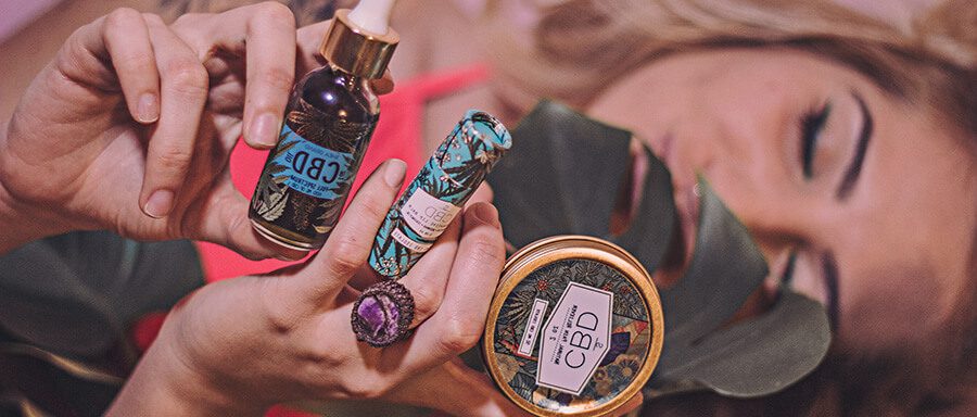 Women with CBD products in her hand. How to find CBD influencers on Instagram. CBD marketing agency. Cannabis marketing. Marijuana marketing company. SEO for cannabis companies.