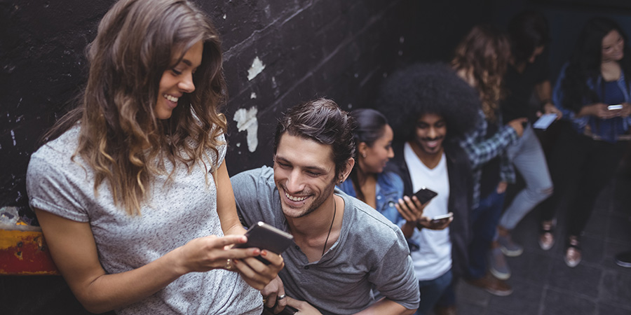 Young adults enjoying the user experience on mobile phones when browsing hemp CBD websites. Hemp CBD SEO agency united states and canada and united kingdom.