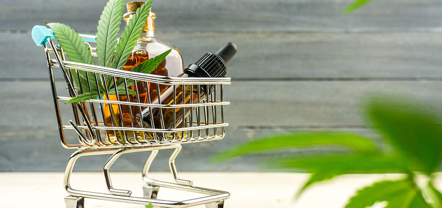 supermarket trolley with cannabis products. canna marketing and marijuana SEO agency.