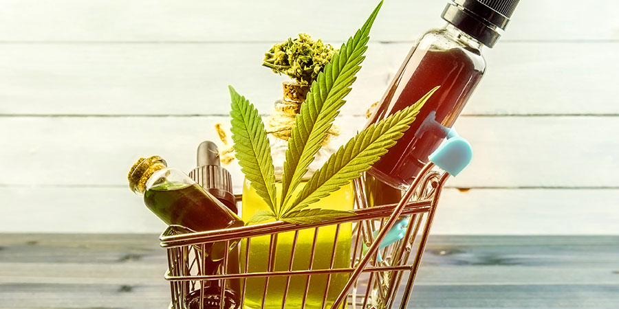 cannabis and vape oil in shopping cart. weed marketing strategy for dispensaries.